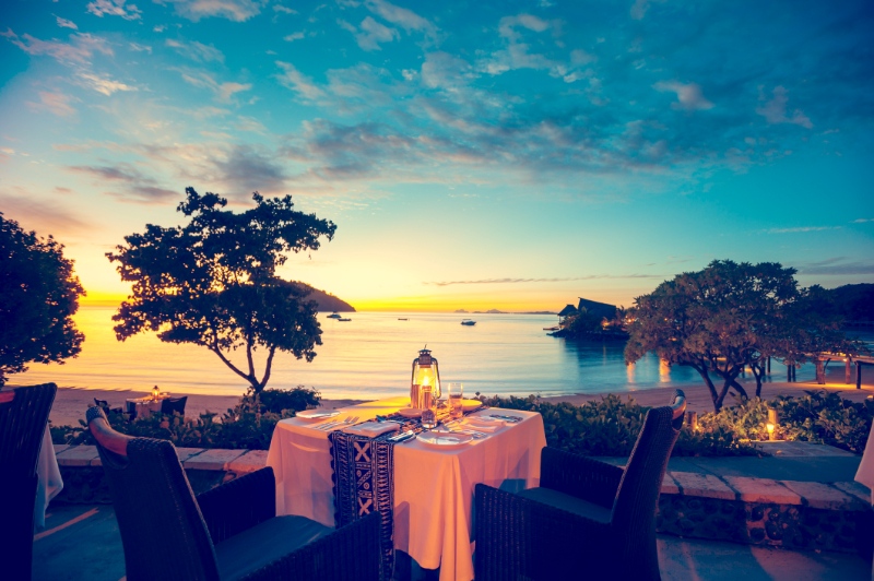 Romantic seaside restaurant at sunset